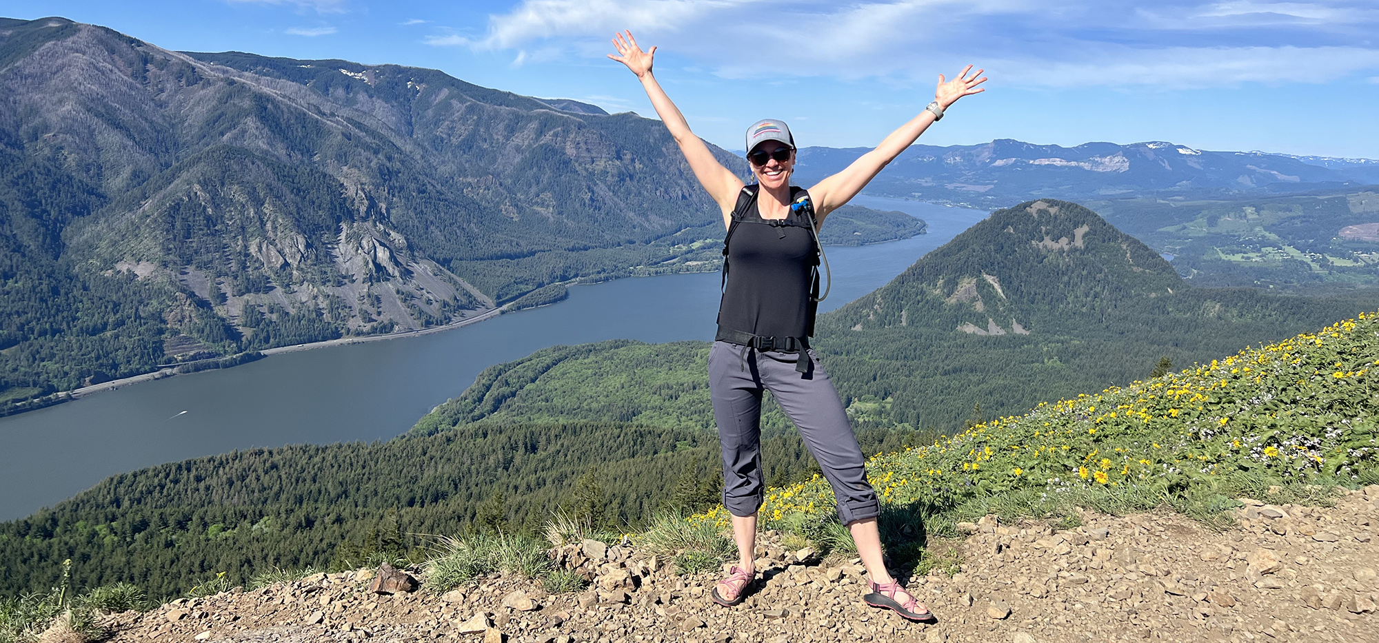 Bethany Colaprete – EdS, NCC, LPC/LMHC on top of a mountain